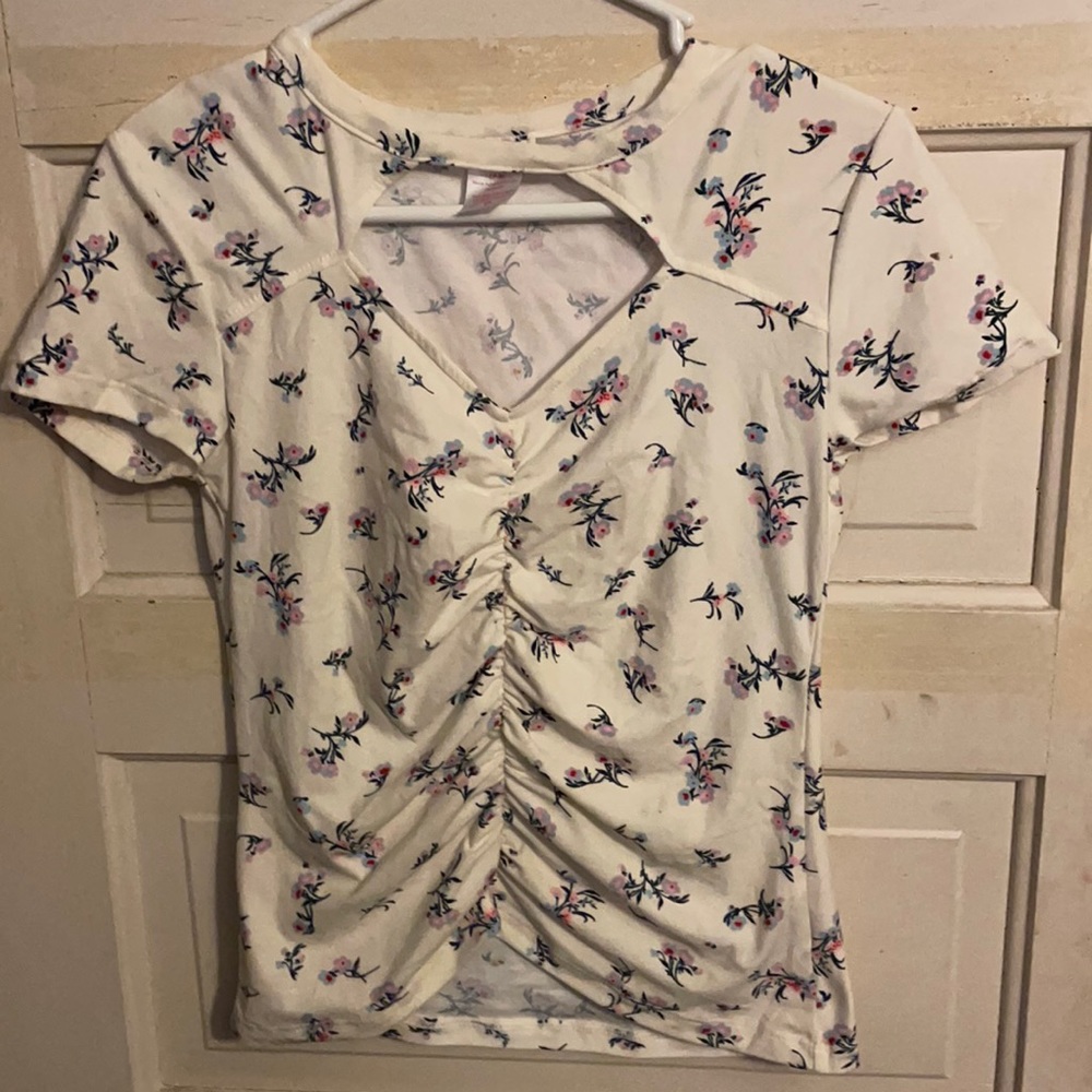 White shirt, open chest part, white with flowers.